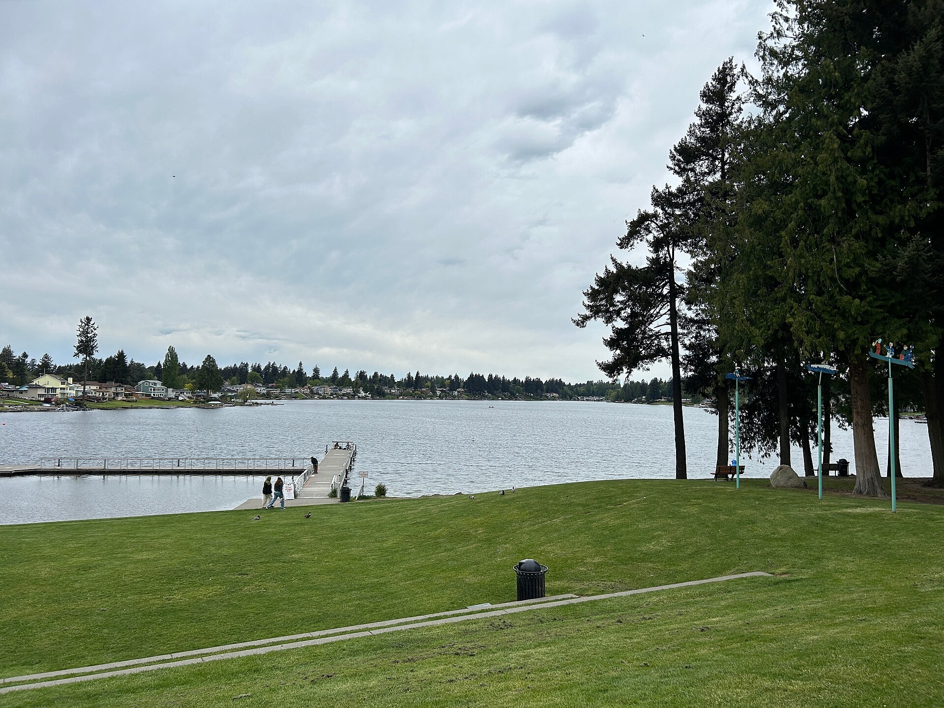 Lake Meridian Kent Washington open water on an overcast day with swim buoys and evergreen shoreline