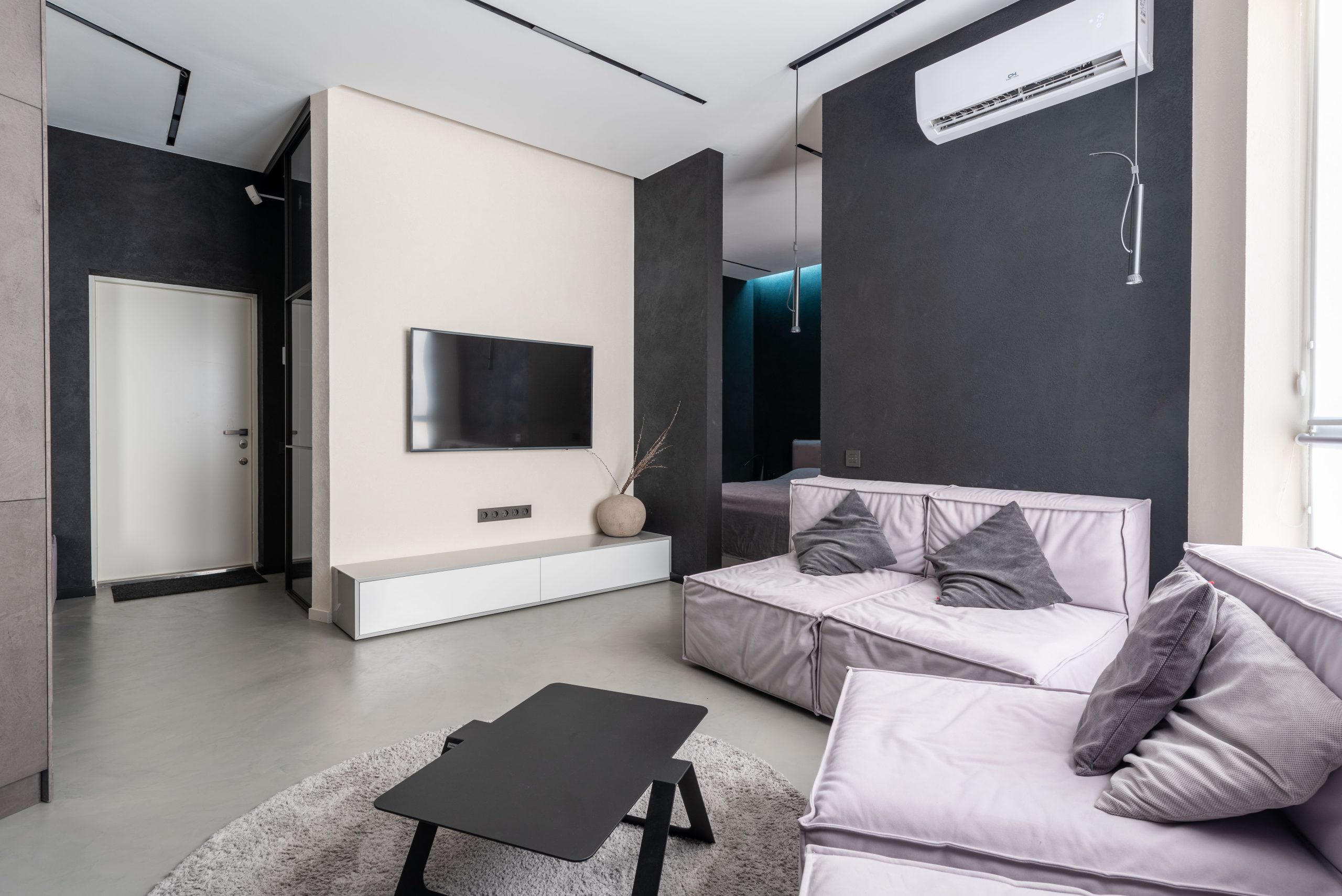 A ductless mini-split wall unit installed in a residential living room